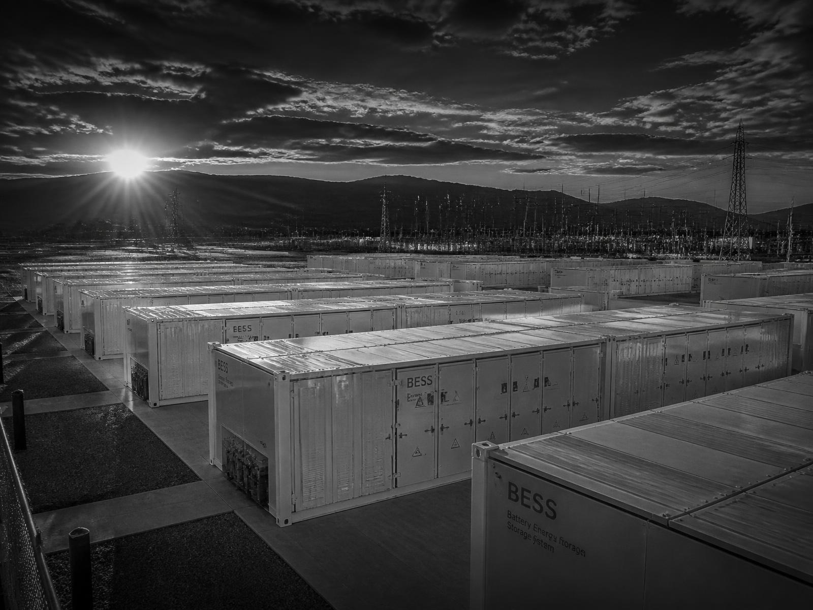 Battery energy storage and electric mobility infrastructure at dusk